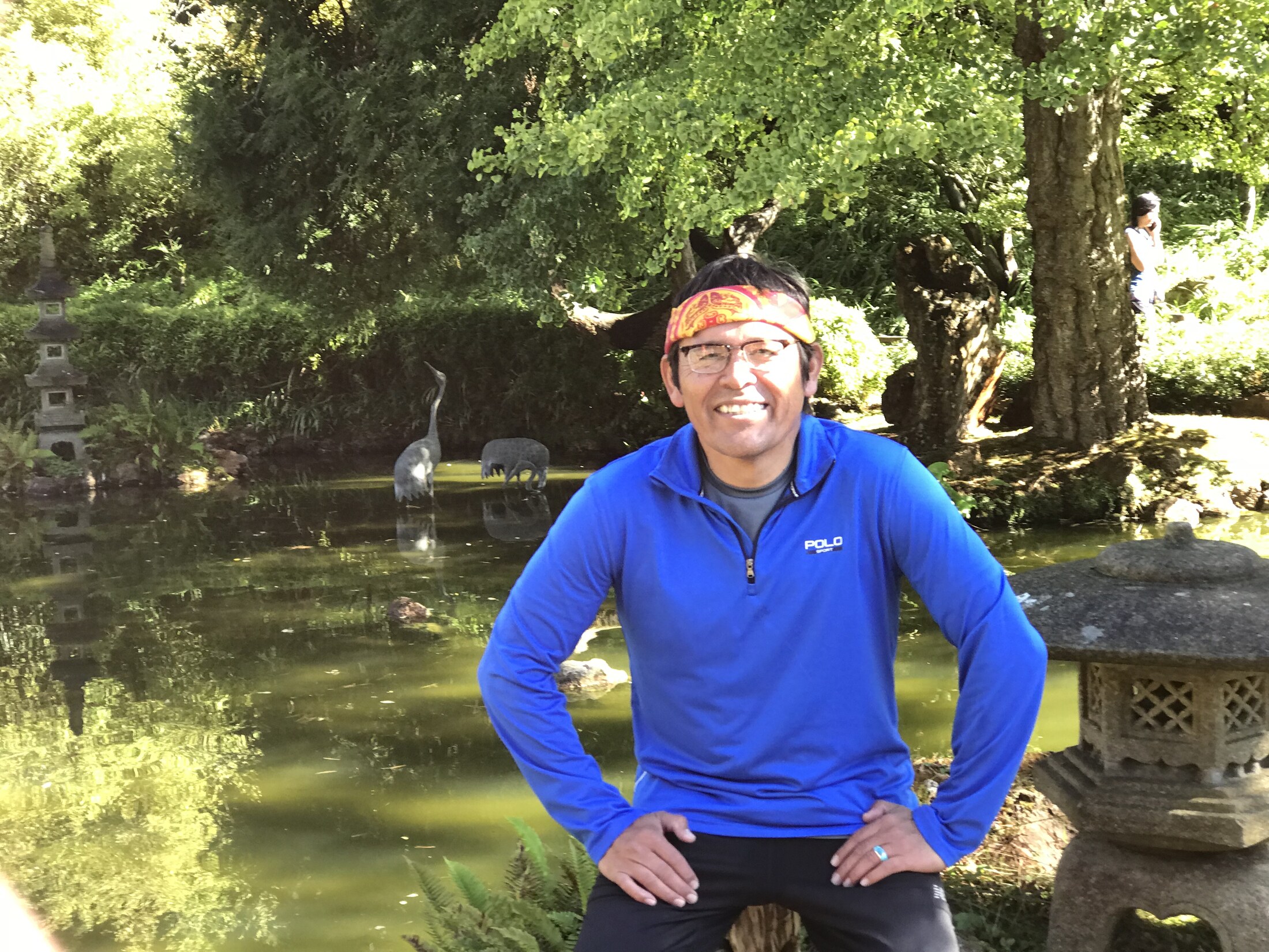 Tony Skrelūnas in the Japanese Tea Garden beside the pond