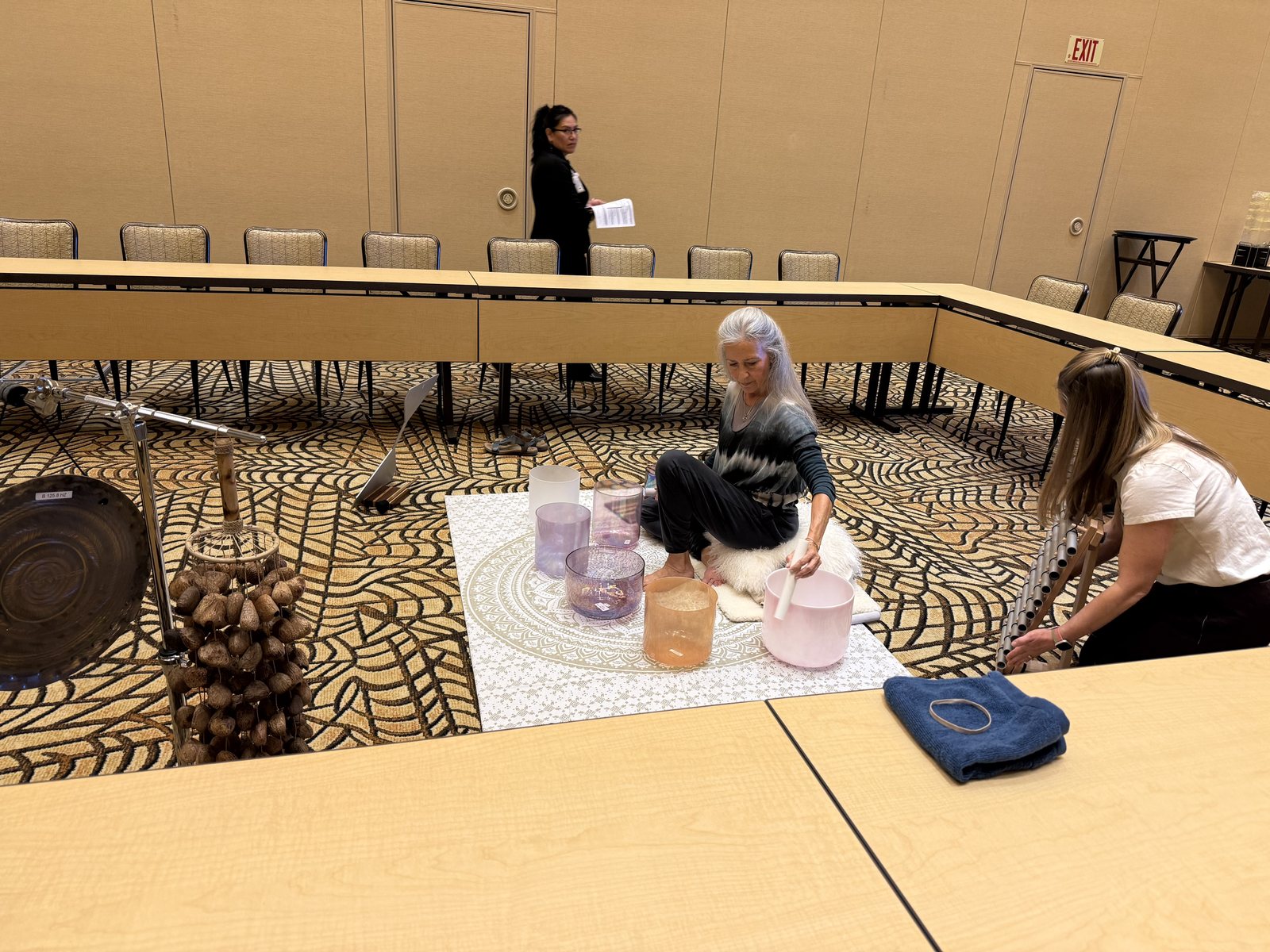 Singing bowls and sound tools arranged on a table before the afternoon sound hour