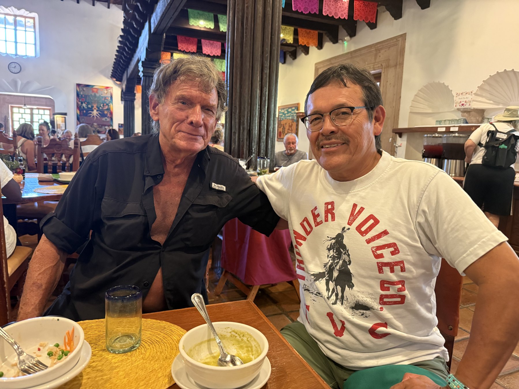 Tom Blue Wolf and Tony Skrelūnas at a table at Rancho La Puerta