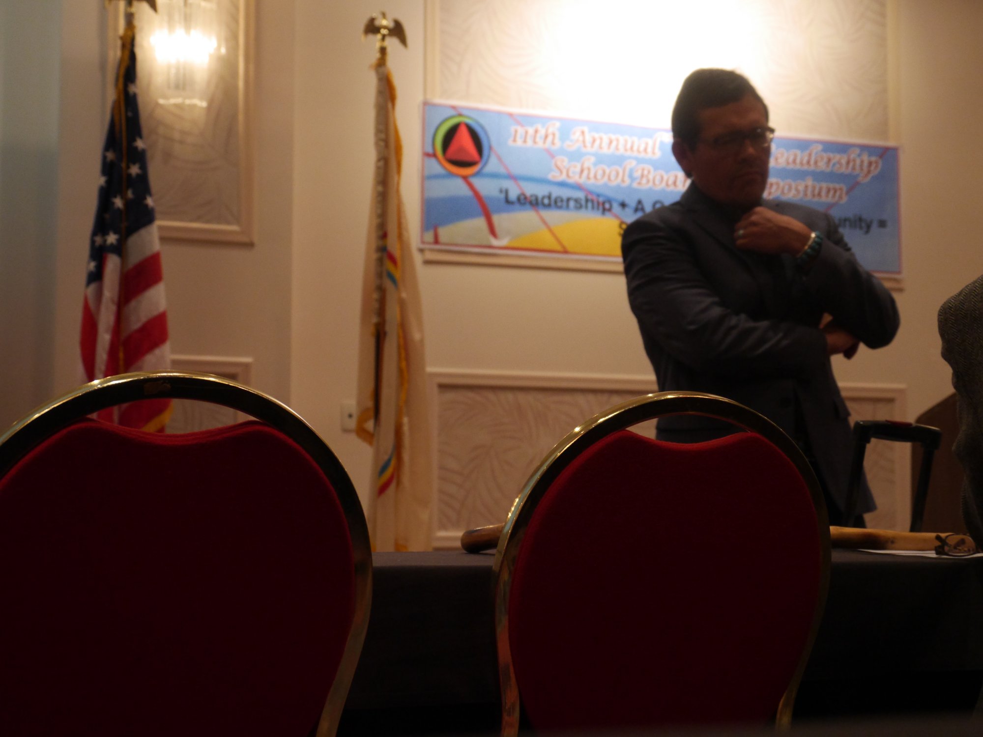 Tony in council with participants beneath the redwoods