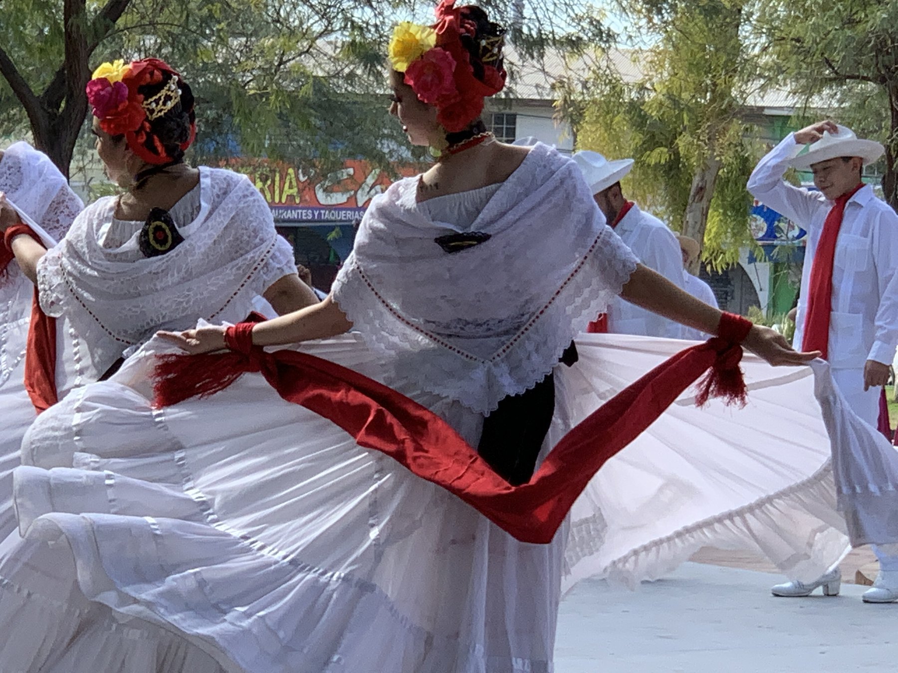 Dancers in white at the fiesta